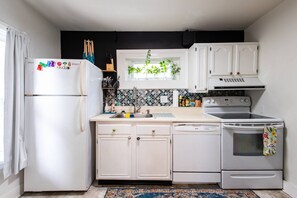 Whip up delicious meals in our charming kitchen. It's cozy, functional, and ready for your culinary adventures!