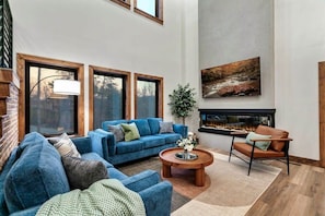 Relax on our new comfy couches while watching the fire and a show.