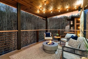 Just off of the living room you can step onto the back deck and enjoy an evening by the fire.