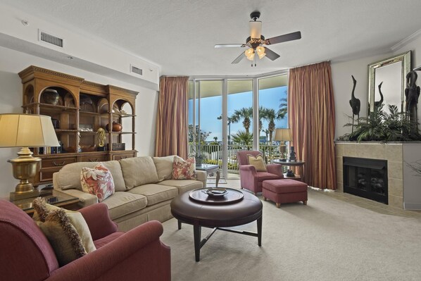 Living Area - The open living area features floor to ceiling 11ft. sliding glass doors, which lead out to a spacious balcony overlooking the Pool.