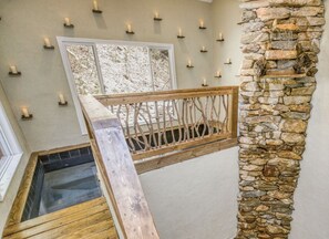 Relax in the spa room with natural waterfall and 12 person hot tub.