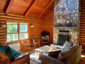 The living room — the windows overlook Little Tunk Pond.