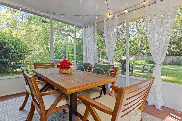Dining at its finest: Our covered porch is the perfect spot to savor meals surrounded by fresh air, natural beauty, and a serene ambiance.