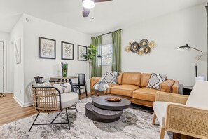Relax and unwind in style here: Our modern living room is the perfect retreat after a day of exploring the city of Tallahassee.
