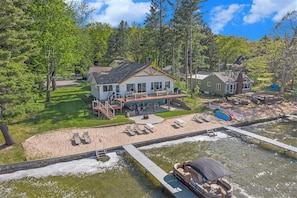 Private Beach with kayaks, pontoon, and stand up paddle boards.