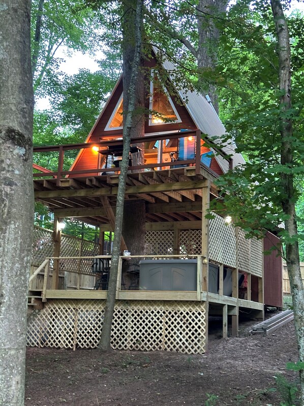 The front of the treehouse facing the river with the entertainment deck below.  