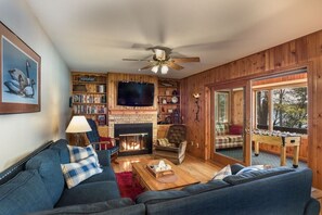 Livingroom with cozy gas fireplace and great view of the lake.