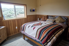 The queen size bed with views from all windows.