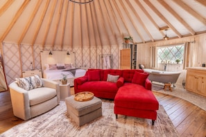 The open-concept Living Space features a comfortable Queen Sleeper Sofa