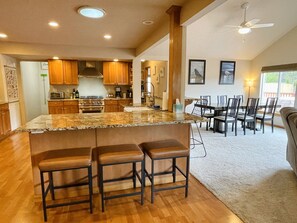 Kitchen with 3 barstools (counter height)