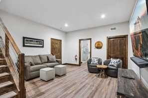 Lower Level Den with TV, Queen Sleeper Sofa, and Twin Sleeper Sofa