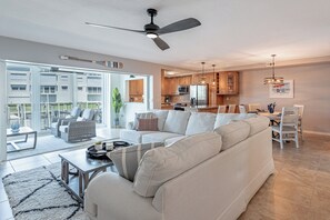 Living room with plenty of natural light and walk-out views to the canal