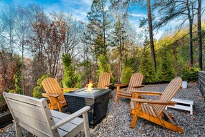 Enjoy conversation with family and friends around the outdoor fire table.