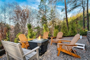 Enjoy conversation with family and friends around the outdoor fire table.
