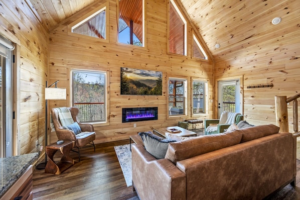 Sit on the comfy sofa and enjoy the views. The fireplace provides ambiance.