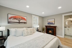 Main floor ensuite with fireplace and luxury hotel linens
