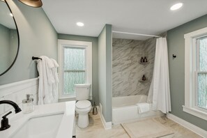 Hall bath with towels, soaps and storage