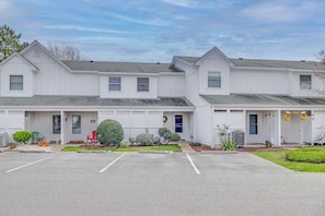 Townhome Exterior | Community Perks | 2 Mi to Beach