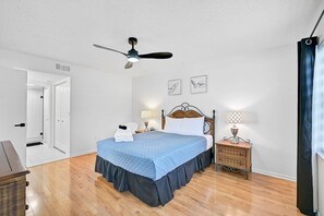 Your sanctuary awaits: a spacious Master bedroom with en suite bath and a private entrance to a tranquil outdoor space.