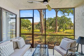 Take in the serenity of nature from the comfort of your screened-in outdoor space.