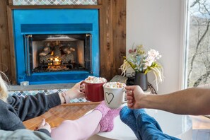 Toast cozy mornings by the fire, savoring life's simple joys.