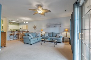 The private balcony off the main living room invites you to step outdoors.