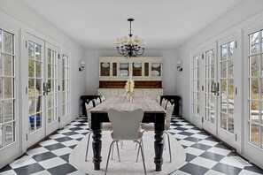 The elegant, beautifully-lit formal dining room comfortably seats eight.