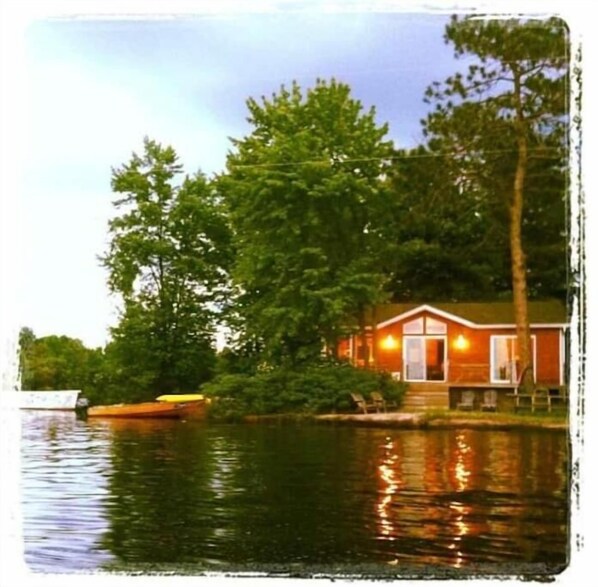 Own dock, deck and swimming area with fire pit in front. 