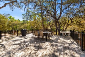 Huge deck with lots of seating and gas grill