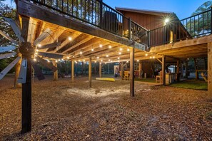 Edison lighting beneath the house for a covered hangout