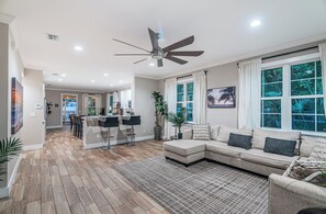 Enjoy our unified open floor plan with high ceilings and expansive windows