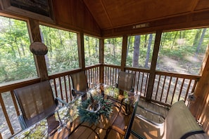 The cabin has a lovely secluded screened in porch which is perfect for reading.