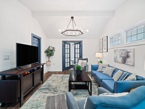 "Relax and unwind in our cozy living space, perfect for movie nights or quiet reading."