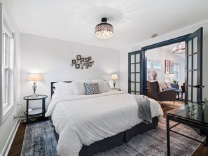 King Sized bed located on the main floor. Sink into plush bedding and enjoy a restful night's sleep in our cozy bedroom retreat.