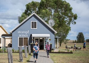 Immerse yourself in the essence of Hunter Valley at Stomp Wines Cellar Door, nestled within the charming Madigan Cottages. Experience the true heart of wine country as you sip, savor, and indulge in a delightful array of wines.