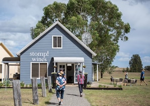 Immerse yourself in the essence of Hunter Valley at Stomp Wines Cellar Door, nestled within the charming Madigan Cottages. Experience the true heart of wine country as you sip, savor, and indulge in a delightful array of wines.