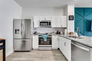 Welcome to your culinary oasis! Our kitchen offers wide-open spaces, perfect for whipping up delicious meals with ease. With ample room to move and create, cooking here feels more like a joyous adventure than a chore.