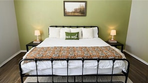Relax in our spacious king bedroom, complete with cozy linens for a restful night's sleep!