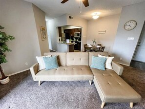 Cozy living space with a big couch and a TV for relaxation!