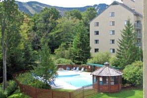 Outdoor pool with a great view of the resort, available during the summer months.
