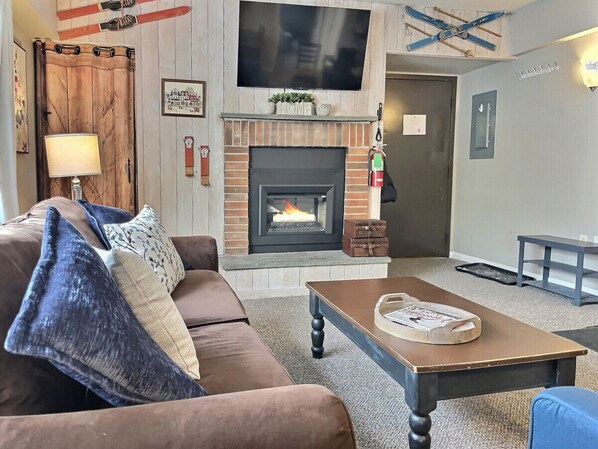 Cozy up in front of the electric fire place, while watching your favorite show on the roku tv!