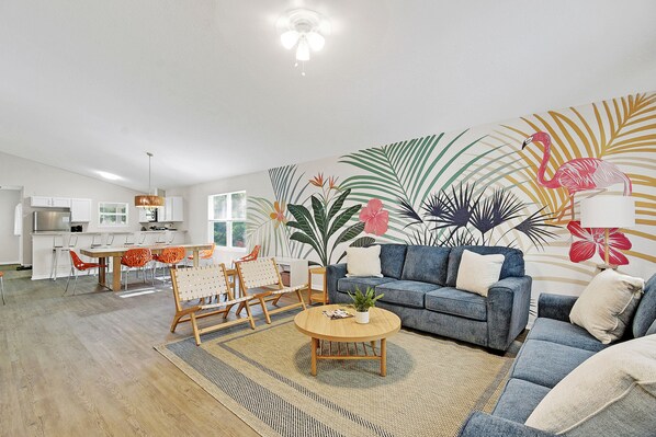 Enjoy this beautiful hand painted wall mural while relaxing in the living room. 