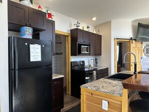 Fully stocked kitchen including drip coffee maker (including regular and decaf coffee, filters, sugar, powdered creamer), crock pot, toaster, etc.