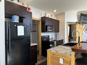 Fully stocked kitchen including drip coffee maker (including regular and decaf coffee, filters, sugar, powdered creamer), crock pot, toaster, etc.