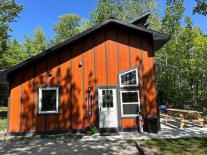 Front of cabin with entry door on the right side. The keyless smart lock is on this door.