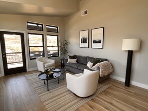 Cozy Living Room with Fireplace and Big Screen TV