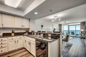 Spacious living room, stylish kitchen, and oceanfront views.