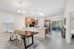 Bright dining room in Navarre, FL, seating for 8 with a fully equipped kitchen.