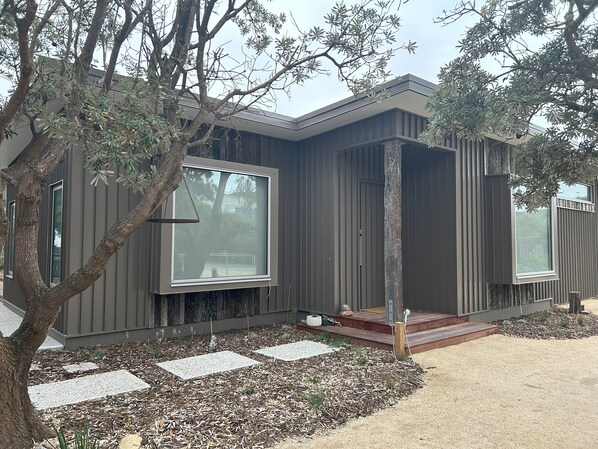 Architectural home blends effortlessly into the landscape