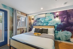 Cozy king bed, dreamy ambiance, modern comforts ensure restful sleep.